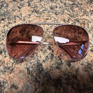 Woman’s Michael Kors Sunglasses. Only worn a couple of times.